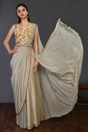 Buy this beige silk stone drape saree set. Make a fashion statement on festive occasions and weddings with designer sarees, designer suits, Indian dresses, Anarkali suits, palazzo suits, designer gowns, sharara suits, and embroidered sarees from Pure Elegance Indian fashion store in the USA.