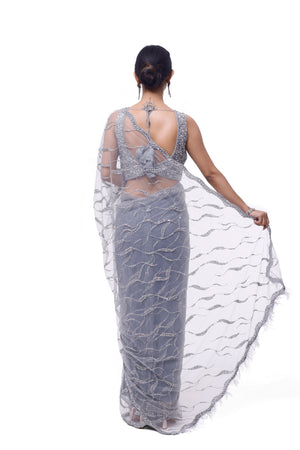 Shop beautiful light grey embroidered net saree online in USA with saree blouse. Look your best at parties and weddings in beautiful designer sarees, embroidered sarees, handwoven sarees, silk sarees, organza saris from Pure Elegance Indian saree store in USA.-back