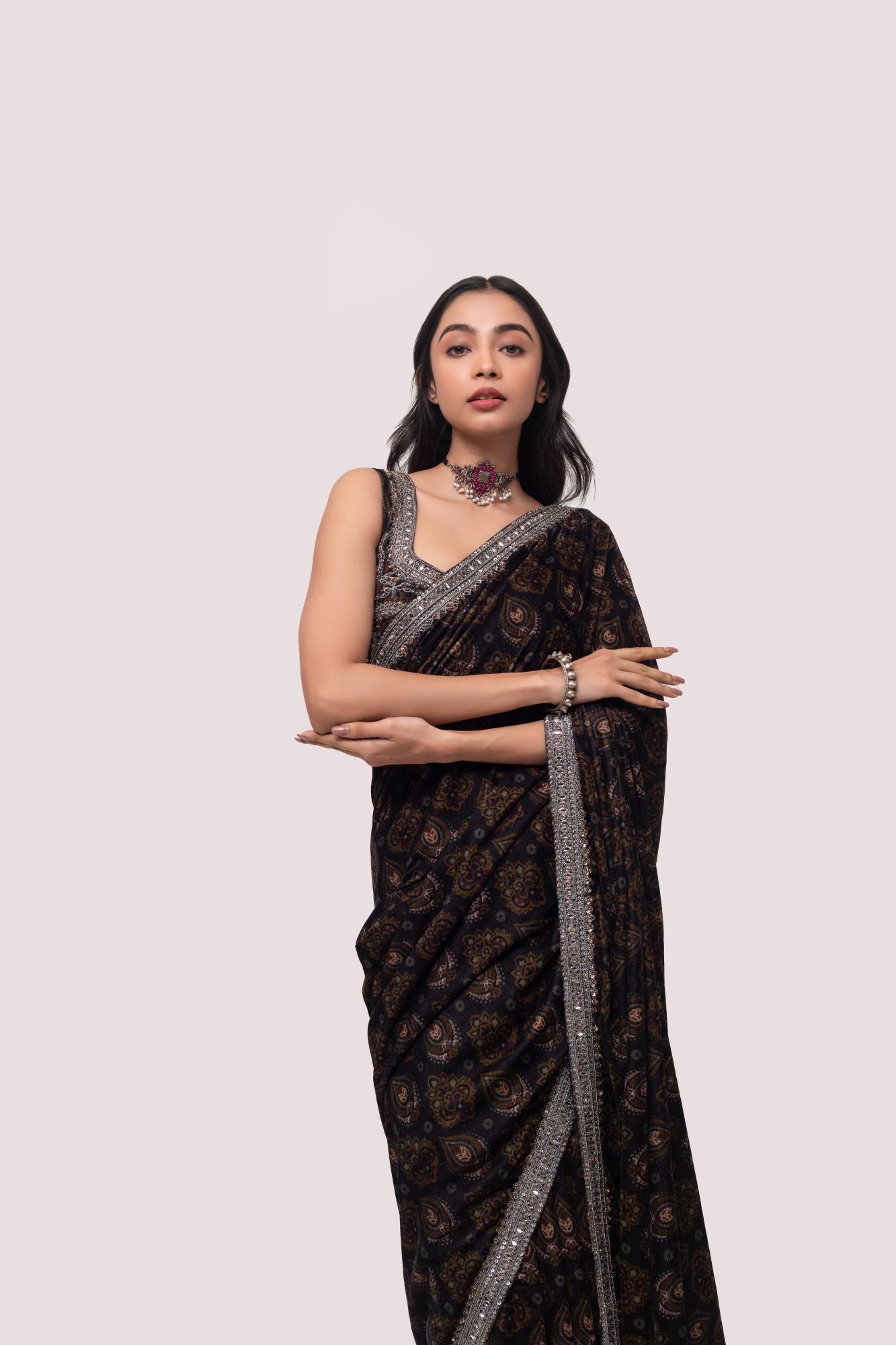 Shop a Beautiful mehndi green velvet saree featuring dark-toned motifs embellished edges and cheed, sequin work. It comes with a highly decorative blouse. Make a fashion statement on festive occasions and weddings with designer sarees, designer suits, Indian dresses, Anarkali suits, palazzo suits, designer gowns, sharara suits, and embroidered sarees from Pure Elegance Indian fashion store in the USA.