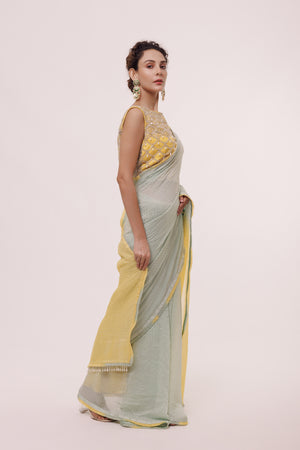 Shop a grey and lemon yellow dual-toned saree embellished with Tikki. Make a fashion statement on festive occasions and weddings with designer sarees, designer suits, Indian dresses, Anarkali suits, palazzo suits, designer gowns, sharara suits, and embroidered sarees from Pure Elegance Indian fashion store in the USA.