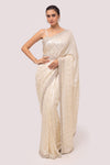 Shop a chickan saree featuring sequin embroidery work. Make a fashion statement on festive occasions and weddings with designer sarees, designer suits, Indian dresses, Anarkali suits, palazzo suits, designer gowns, sharara suits, and embroidered sarees from Pure Elegance Indian fashion store in the USA.