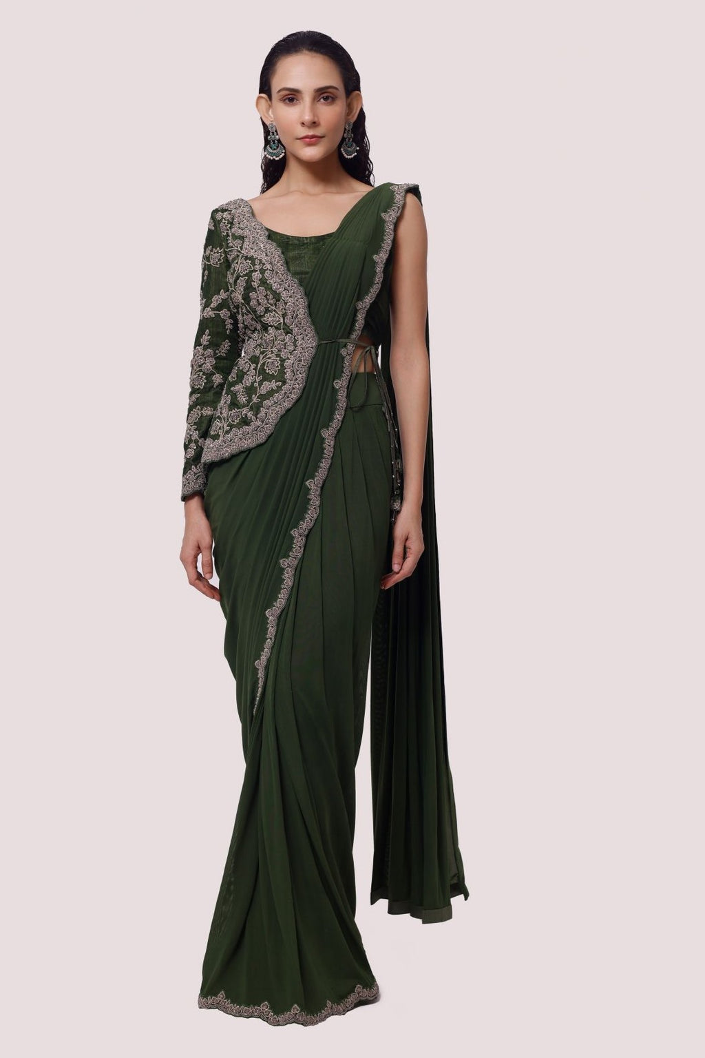 Shop the olive green zardozi work saree with a designer blouse. Make a fashion statement on festive occasions and weddings with designer sarees, designer suits, Indian dresses, Anarkali suits, palazzo suits, designer gowns, sharara suits, and embroidered sarees from Pure Elegance Indian fashion store in the USA.