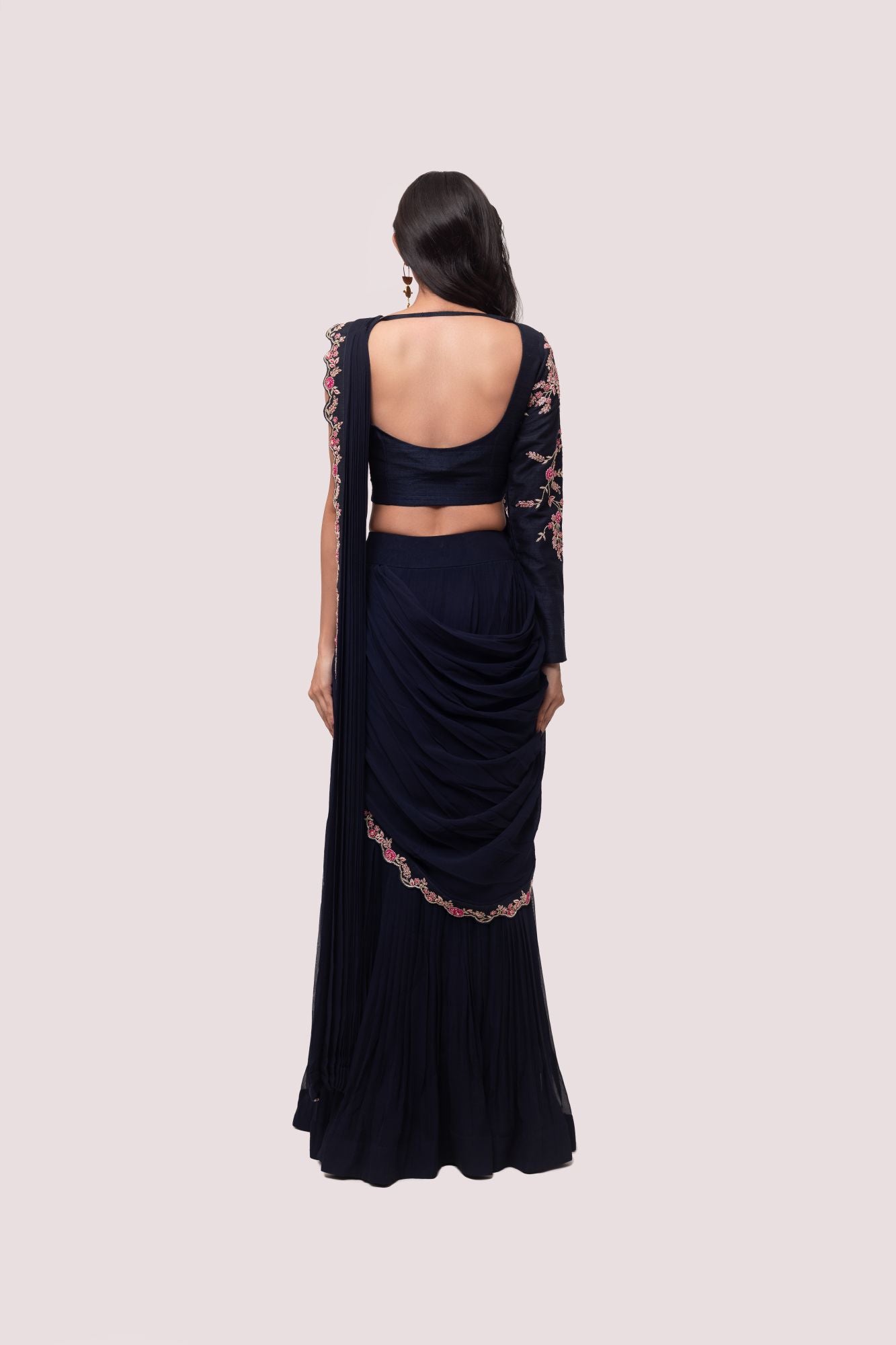 Shop navy blue saree with faux half jacket blouse. Make a fashion statement on festive occasions and weddings with designer sarees, designer suits, Indian dresses, Anarkali suits, palazzo suits, designer gowns, sharara suits, and embroidered sarees from Pure Elegance Indian fashion store in the USA.