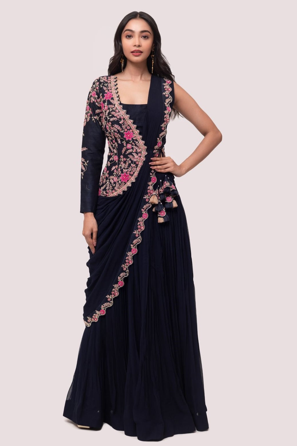 Shop navy blue saree with faux half jacket blouse. Make a fashion statement on festive occasions and weddings with designer sarees, designer suits, Indian dresses, Anarkali suits, palazzo suits, designer gowns, sharara suits, and embroidered sarees from Pure Elegance Indian fashion store in the USA.