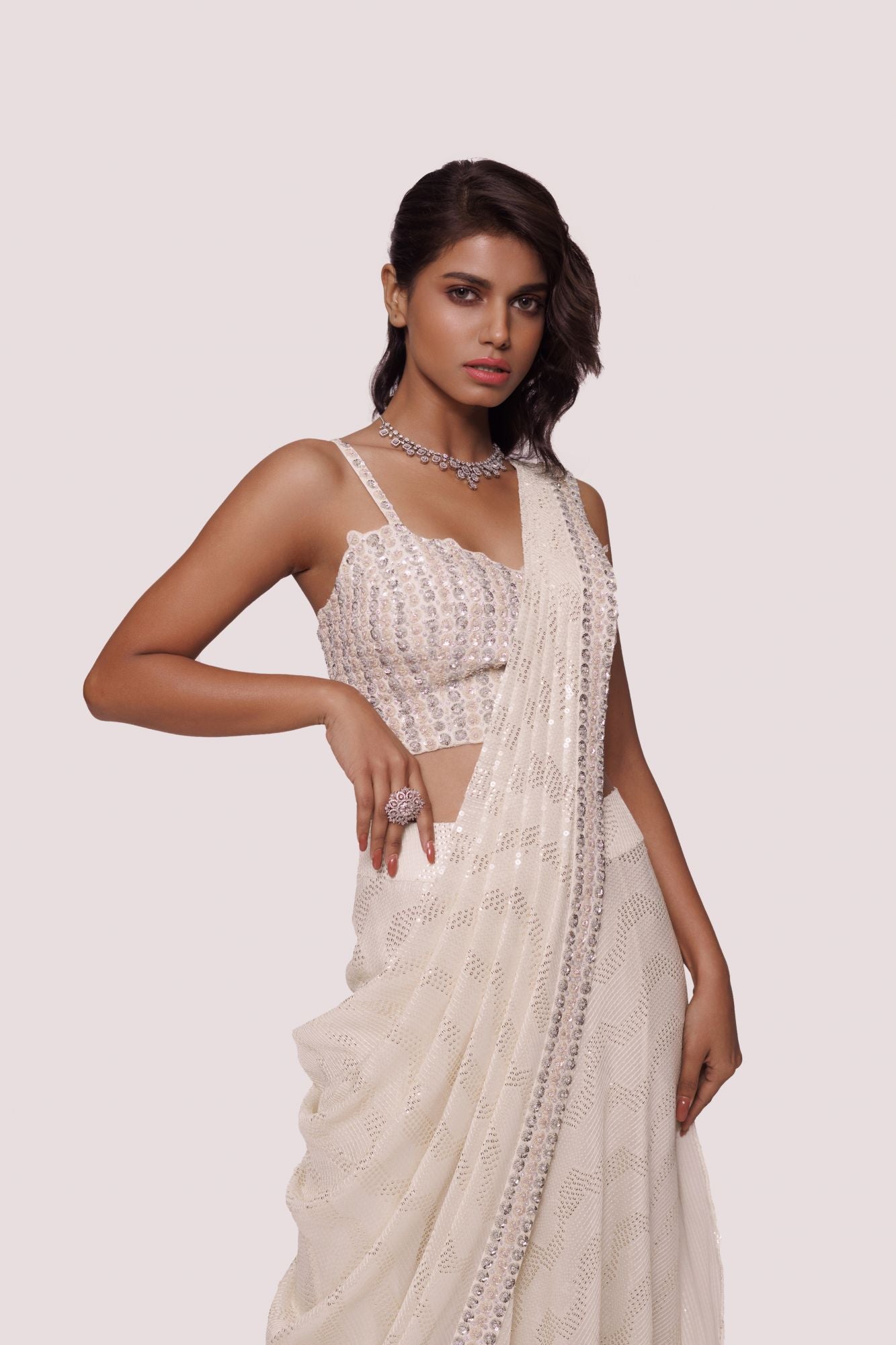 Shop offwhite sequinned chikankari saree. Make a fashion statement on festive occasions and weddings with designer sarees, designer suits, Indian dresses, Anarkali suits, palazzo suits, designer gowns, sharara suits, and embroidered sarees from Pure Elegance Indian fashion store in the USA.