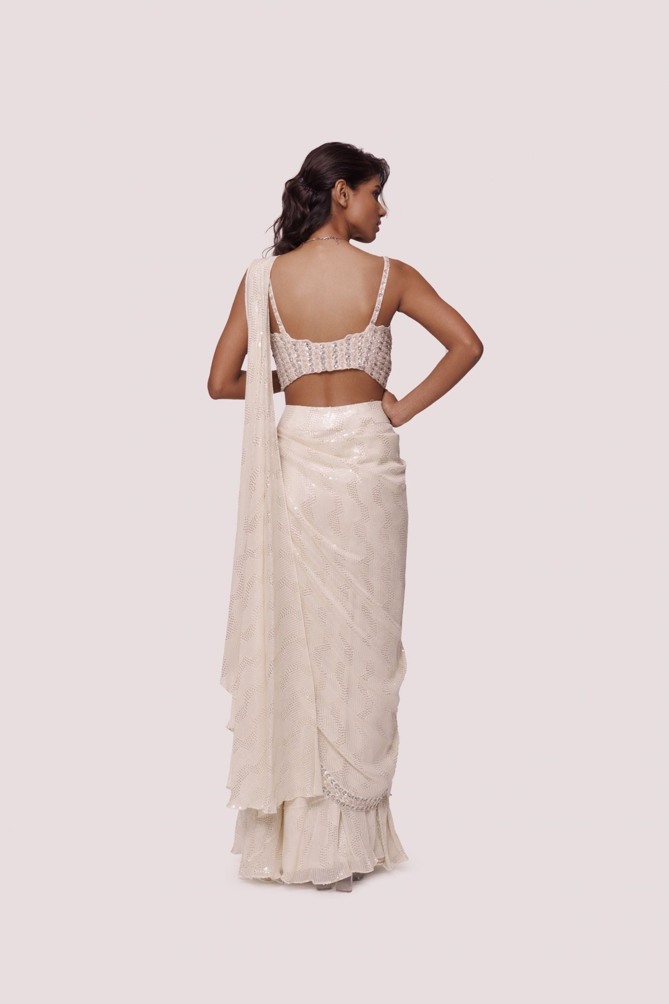 Shop offwhite sequinned chikankari saree. Make a fashion statement on festive occasions and weddings with designer sarees, designer suits, Indian dresses, Anarkali suits, palazzo suits, designer gowns, sharara suits, and embroidered sarees from Pure Elegance Indian fashion store in the USA.