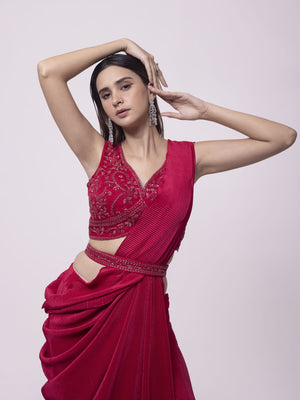 Shop a red drape saree set featuring mirror work. Make a fashion statement on festive occasions and weddings with designer sarees, designer suits, Indian dresses, Anarkali suits, palazzo suits, designer gowns, sharara suits, and embroidered sarees from Pure Elegance Indian fashion store in the USA.