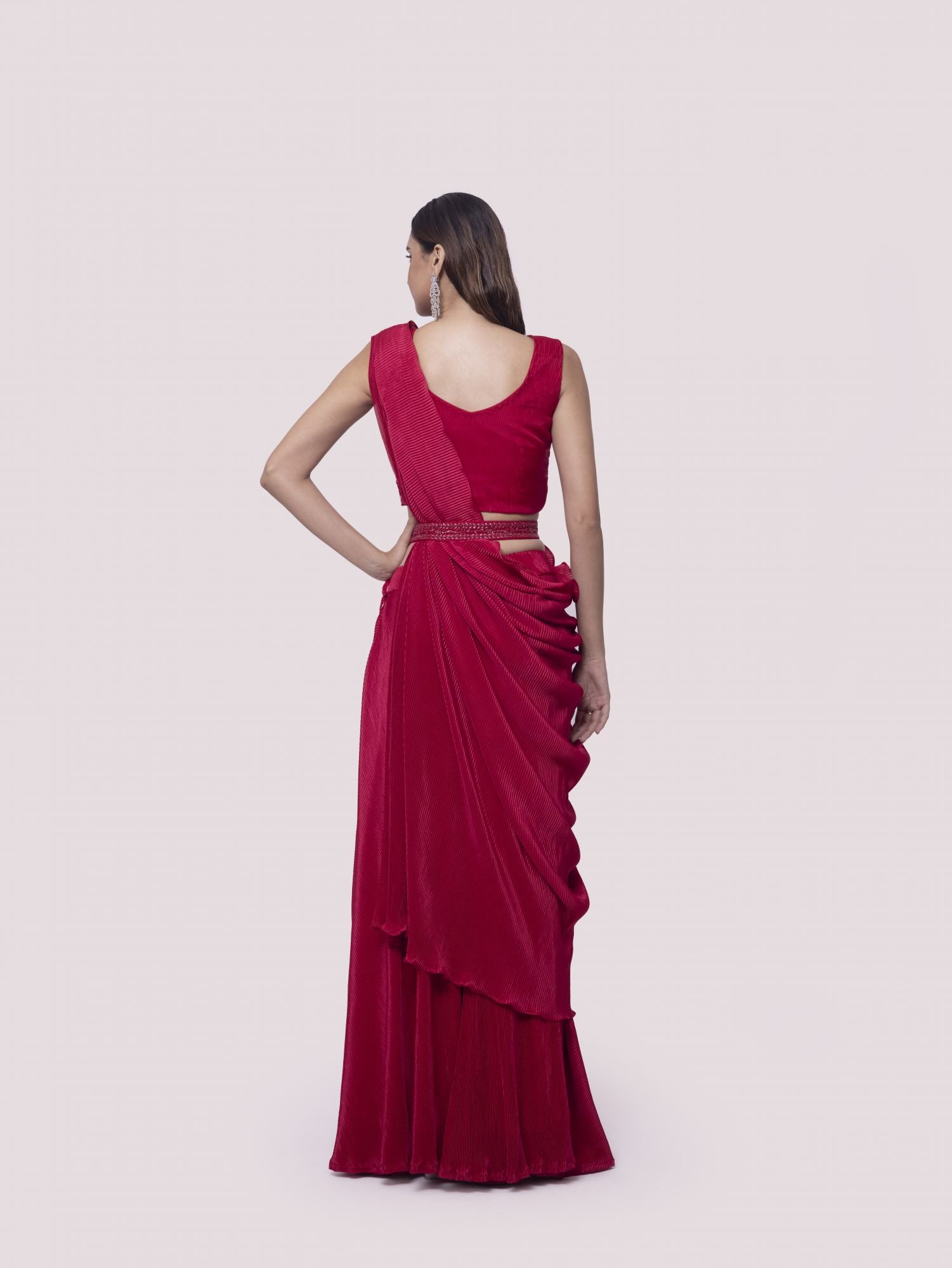 Shop a red drape saree set featuring mirror work. Make a fashion statement on festive occasions and weddings with designer sarees, designer suits, Indian dresses, Anarkali suits, palazzo suits, designer gowns, sharara suits, and embroidered sarees from Pure Elegance Indian fashion store in the USA.