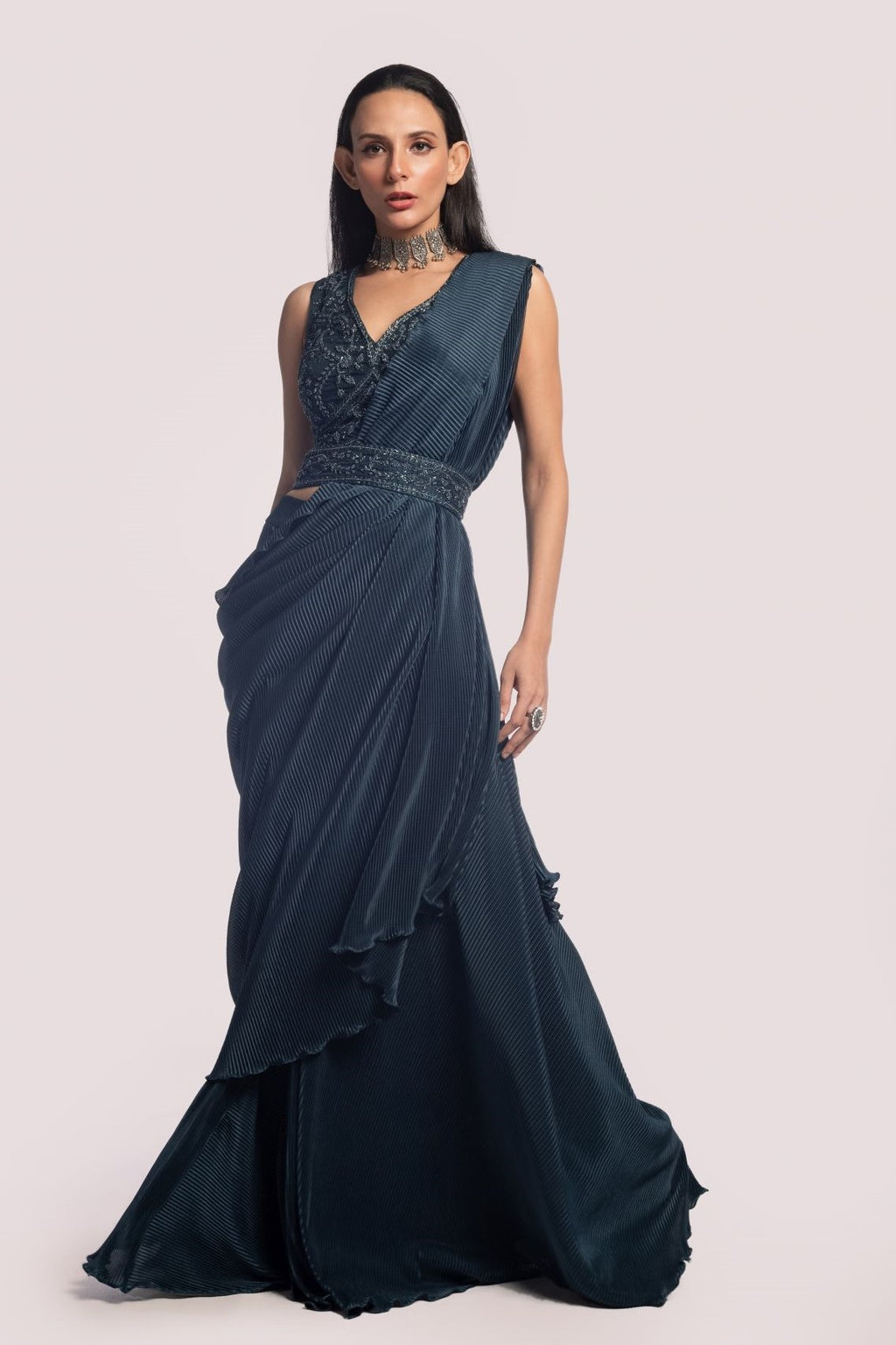Shop a navy blue drape saree set embedded with a mirror. Make a fashion statement on festive occasions and weddings with designer sarees, designer suits, Indian dresses, Anarkali suits, palazzo suits, designer gowns, sharara suits, and embroidered sarees from Pure Elegance Indian fashion store in the USA.