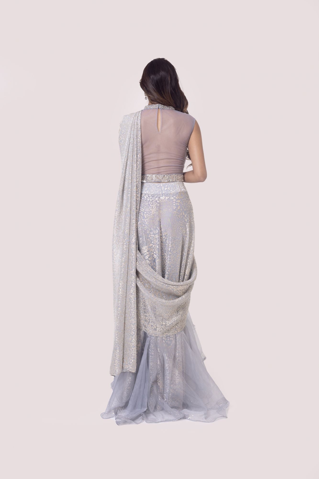 Shop a grey silver crush fabric drape saree set. Make a fashion statement on festive occasions and weddings with designer sarees, designer suits, Indian dresses, Anarkali suits, palazzo suits, designer gowns, sharara suits, and embroidered sarees from Pure Elegance Indian fashion store in the USA.