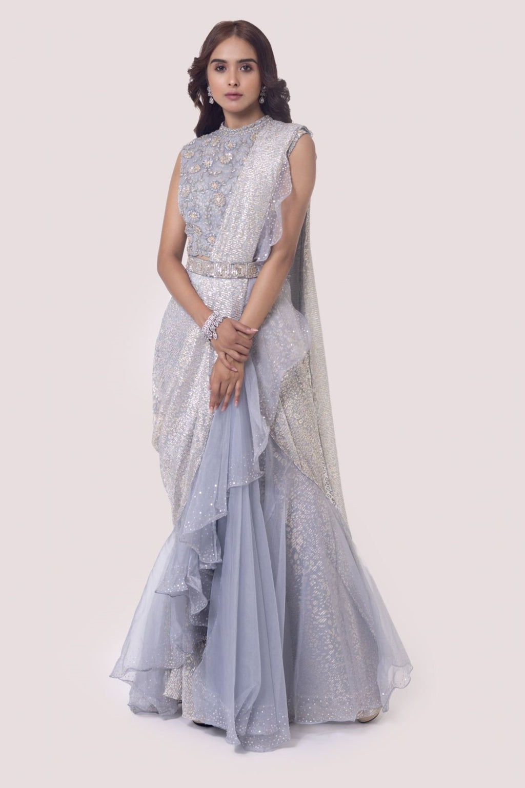 Shop a grey silver crush fabric drape saree set. Make a fashion statement on festive occasions and weddings with designer sarees, designer suits, Indian dresses, Anarkali suits, palazzo suits, designer gowns, sharara suits, and embroidered sarees from Pure Elegance Indian fashion store in the USA.