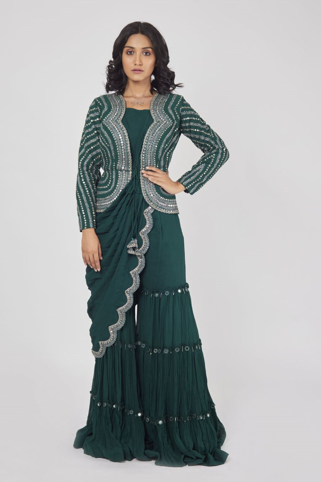 Shop a green embroidered drape saree set with jacket and plazo. Make a fashion statement on festive occasions and weddings with designer sarees, designer suits, Indian dresses, Anarkali suits, palazzo suits, designer gowns, sharara suits, and embroidered sarees from Pure Elegance Indian fashion store in the USA.