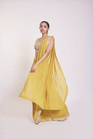 Shop yellow drape set with mirror work. Make a fashion statement on festive occasions and weddings with designer sarees, designer suits, Indian dresses, Anarkali suits, palazzo suits, designer gowns, sharara suits, and embroidered sarees from Pure Elegance Indian fashion store in the USA.