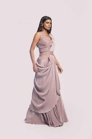 Shop pink crush fabric drape saree with embroidered blouse. Make a fashion statement on festive occasions and weddings with designer sarees, designer suits, Indian dresses, Anarkali suits, palazzo suits, designer gowns, sharara suits, and embroidered sarees from Pure Elegance Indian fashion store in the USA.