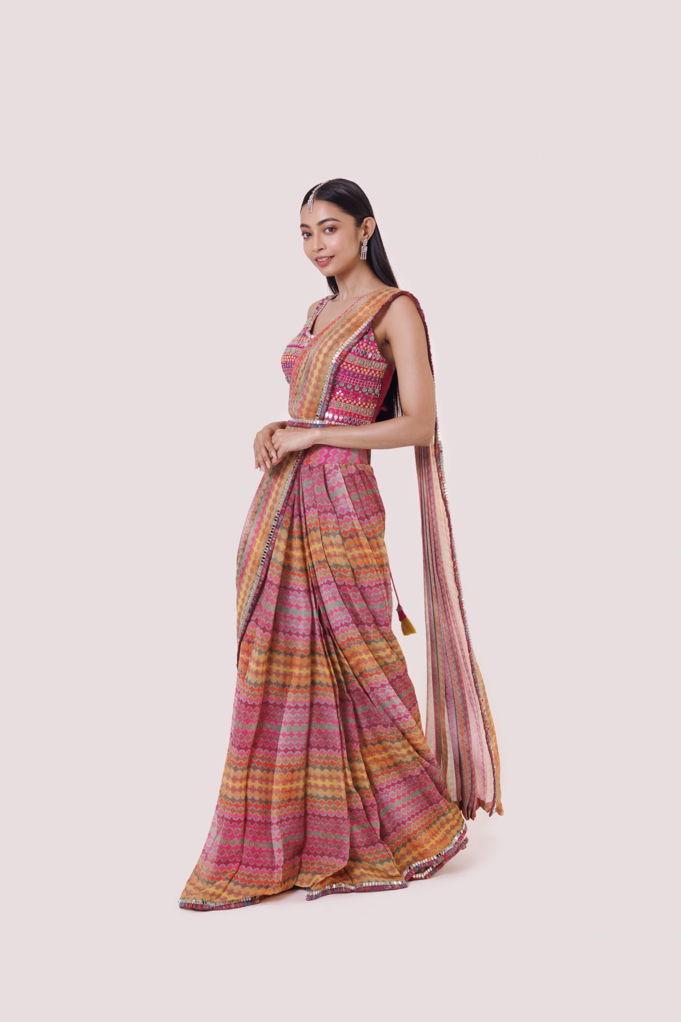 Shop multicolored embroidered saree with mirror and moti work. Make a fashion statement on festive occasions and weddings with designer sarees, designer suits, Indian dresses, Anarkali suits, palazzo suits, designer gowns, sharara suits, and embroidered sarees from Pure Elegance Indian fashion store in the USA.