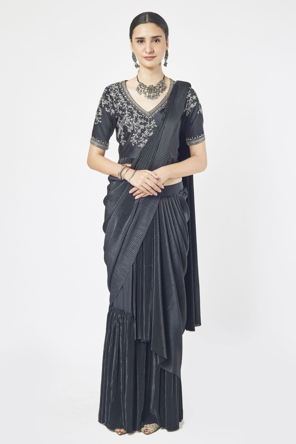 Shop a black drape saree with mirror and cutdana work. Make a fashion statement on festive occasions and weddings with designer sarees, designer suits, Indian dresses, Anarkali suits, palazzo suits, designer gowns, sharara suits, and embroidered sarees from Pure Elegance Indian fashion store in the USA.