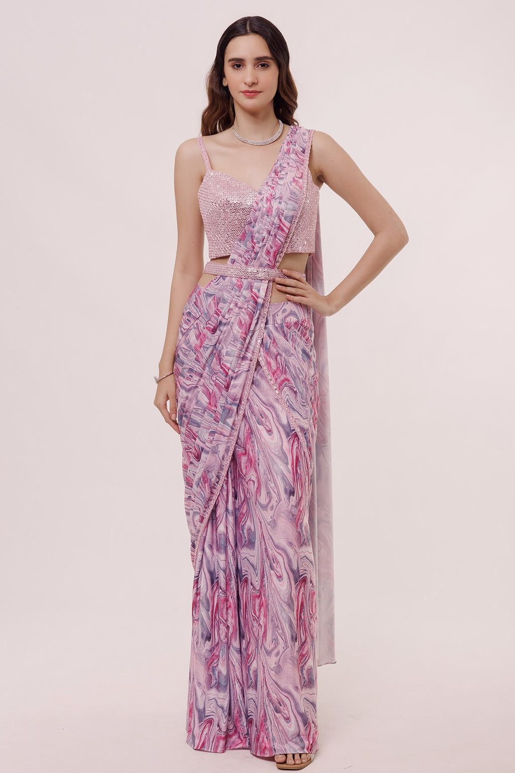 Shop a Multicolour printed fluid design saree with narrow embellished edges. Comes with a wholly embellished belt and blouse. Embellishments include Tikki and cutdana work Shop designer saris online in the USA from Pure Elegance.