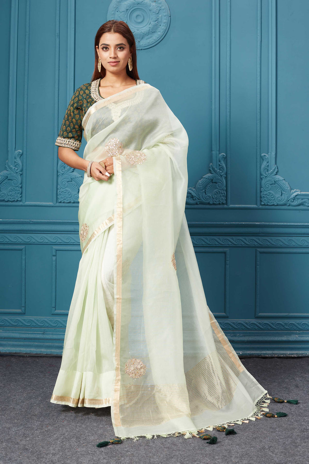 Buy mint green emrbroidered organza silk sari online in USA with blouse. Look royal at weddings and festive occasions in exquisite designer sarees, handwoven sarees, pure silk saris, Banarasi sarees, Kanchipuram silk sarees from Pure Elegance Indian saree store in USA. -full view