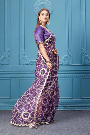 Buy beautiful purple bandhej gota work organza silk sari online in USA with designer blouse. Look royal at weddings and festive occasions in exquisite designer sarees, handwoven sarees, pure silk saris, Banarasi sarees, Kanchipuram silk sarees from Pure Elegance Indian saree store in USA. -side