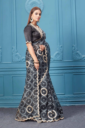 Buy black bandhej gota work organza silk saree online in USA with designer blouse. Look royal at weddings and festive occasions in exquisite designer sarees, handwoven sarees, pure silk saris, Banarasi sarees, Kanchipuram silk sarees from Pure Elegance Indian saree store in USA. -side