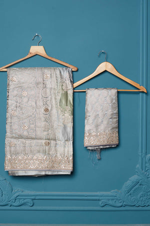 Shop beautiful grey Mashru Banarasi saree online in USA with embroidery. Look royal at weddings and festive occasions in exquisite designer sarees, handwoven sarees, pure silk saris, Banarasi sarees, Kanchipuram silk sarees from Pure Elegance Indian saree store in USA. -blouse