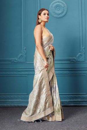 Shop beautiful grey Mashru Banarasi saree online in USA with embroidery. Look royal at weddings and festive occasions in exquisite designer sarees, handwoven sarees, pure silk saris, Banarasi sarees, Kanchipuram silk sarees from Pure Elegance Indian saree store in USA. -side