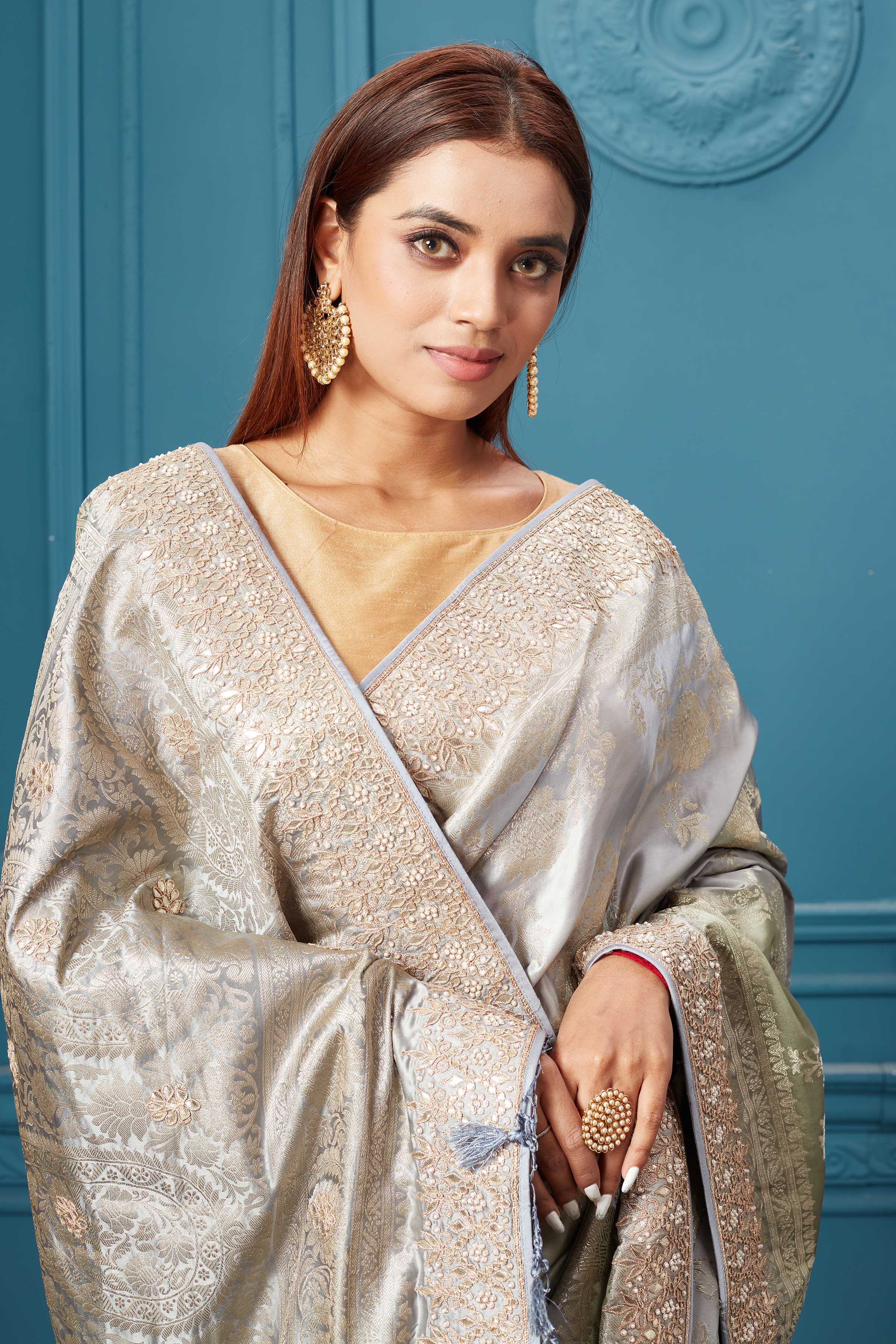Shop beautiful grey Mashru Banarasi saree online in USA with embroidery. Look royal at weddings and festive occasions in exquisite designer sarees, handwoven sarees, pure silk saris, Banarasi sarees, Kanchipuram silk sarees from Pure Elegance Indian saree store in USA. -closeup
