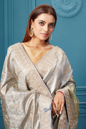 Shop beautiful grey Mashru Banarasi saree online in USA with embroidery. Look royal at weddings and festive occasions in exquisite designer sarees, handwoven sarees, pure silk saris, Banarasi sarees, Kanchipuram silk sarees from Pure Elegance Indian saree store in USA. -closeup