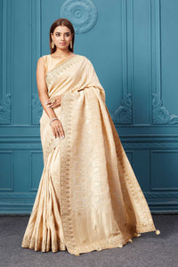 Shop cream Mashru Banarasi saree online in USA with embroidery. Look royal at weddings and festive occasions in exquisite designer sarees, handwoven sarees, pure silk saris, Banarasi sarees, Kanchipuram silk sarees from Pure Elegance Indian saree store in USA. -full view