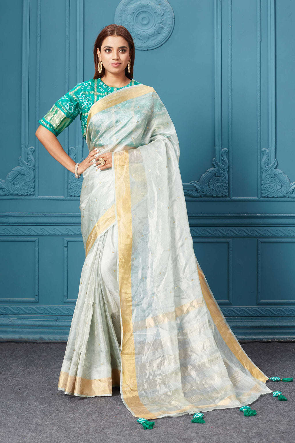 Buy beautiful white tissue silk saree online in USA with green embroidered blouse. Look royal at weddings and festive occasions in exquisite designer sarees, handwoven sarees, pure silk saris, Banarasi sarees, Kanchipuram silk sarees from Pure Elegance Indian saree store in USA. -full view