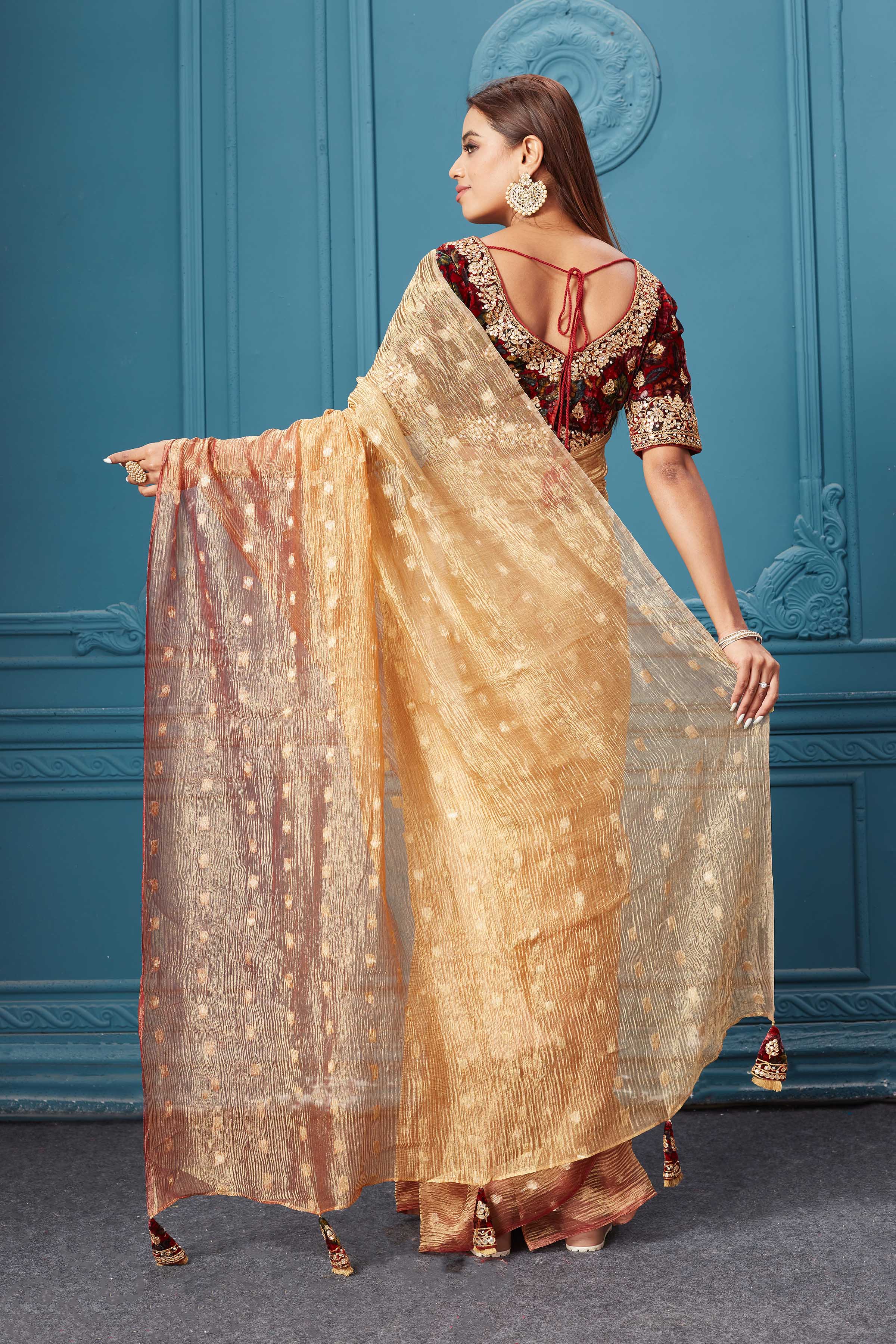 Buy golden tissue saree online in USA with velvet embroidered blouse. Look royal at weddings and festive occasions in exquisite designer sarees, handwoven sarees, pure silk saris, Banarasi sarees, Kanchipuram silk sarees from Pure Elegance Indian saree store in USA. -back