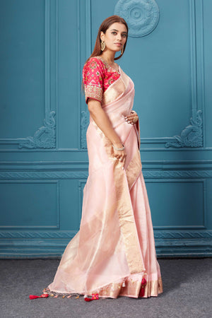 Buy light pink organza silk saree online in USA with pink Patola embroidered blouse. Look royal at weddings and festive occasions in exquisite designer sarees, handwoven sarees, pure silk saris, Banarasi sarees, Kanchipuram silk sarees from Pure Elegance Indian saree store in USA. -side