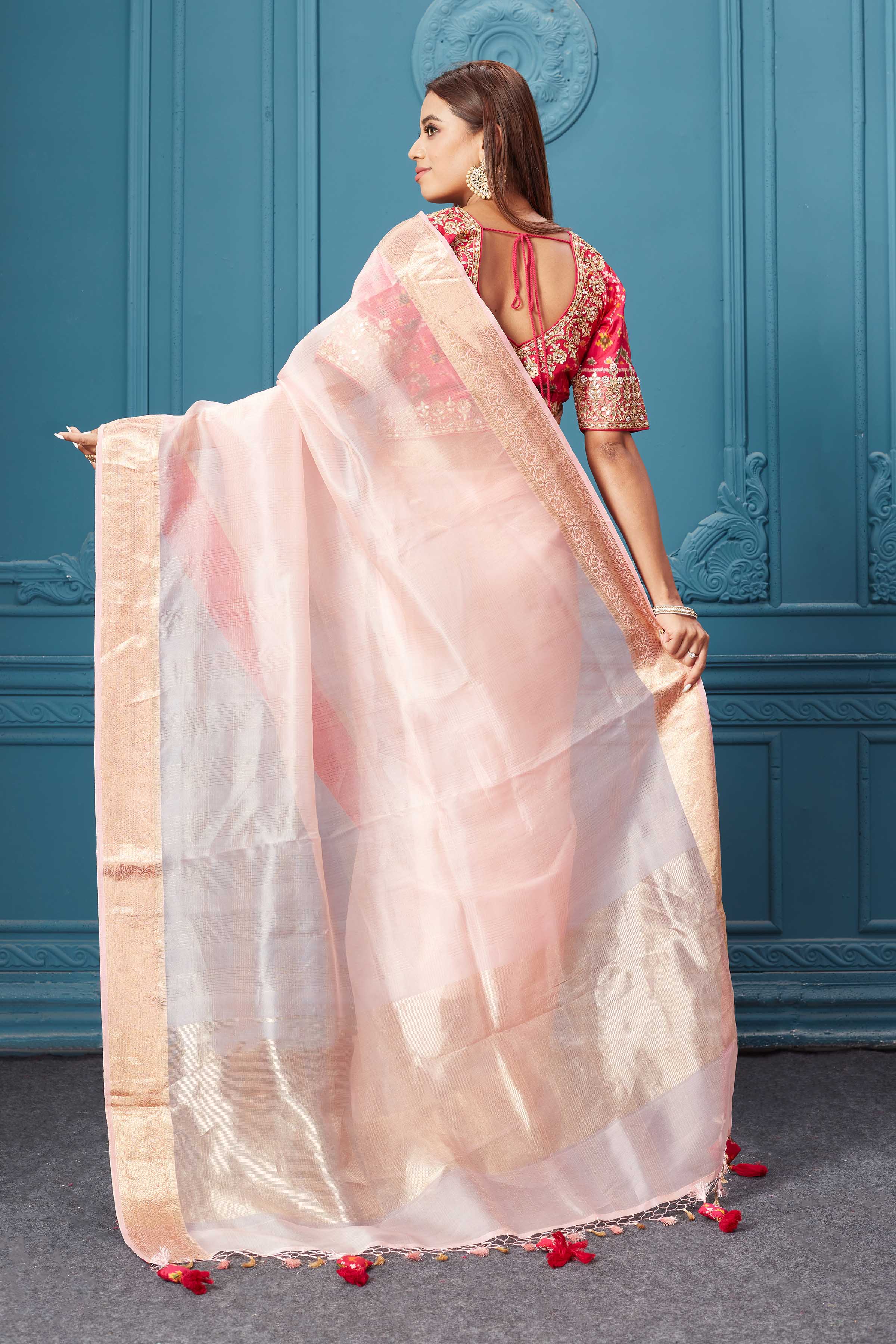 Buy light pink organza silk saree online in USA with pink Patola embroidered blouse. Look royal at weddings and festive occasions in exquisite designer sarees, handwoven sarees, pure silk saris, Banarasi sarees, Kanchipuram silk sarees from Pure Elegance Indian saree store in USA. -back