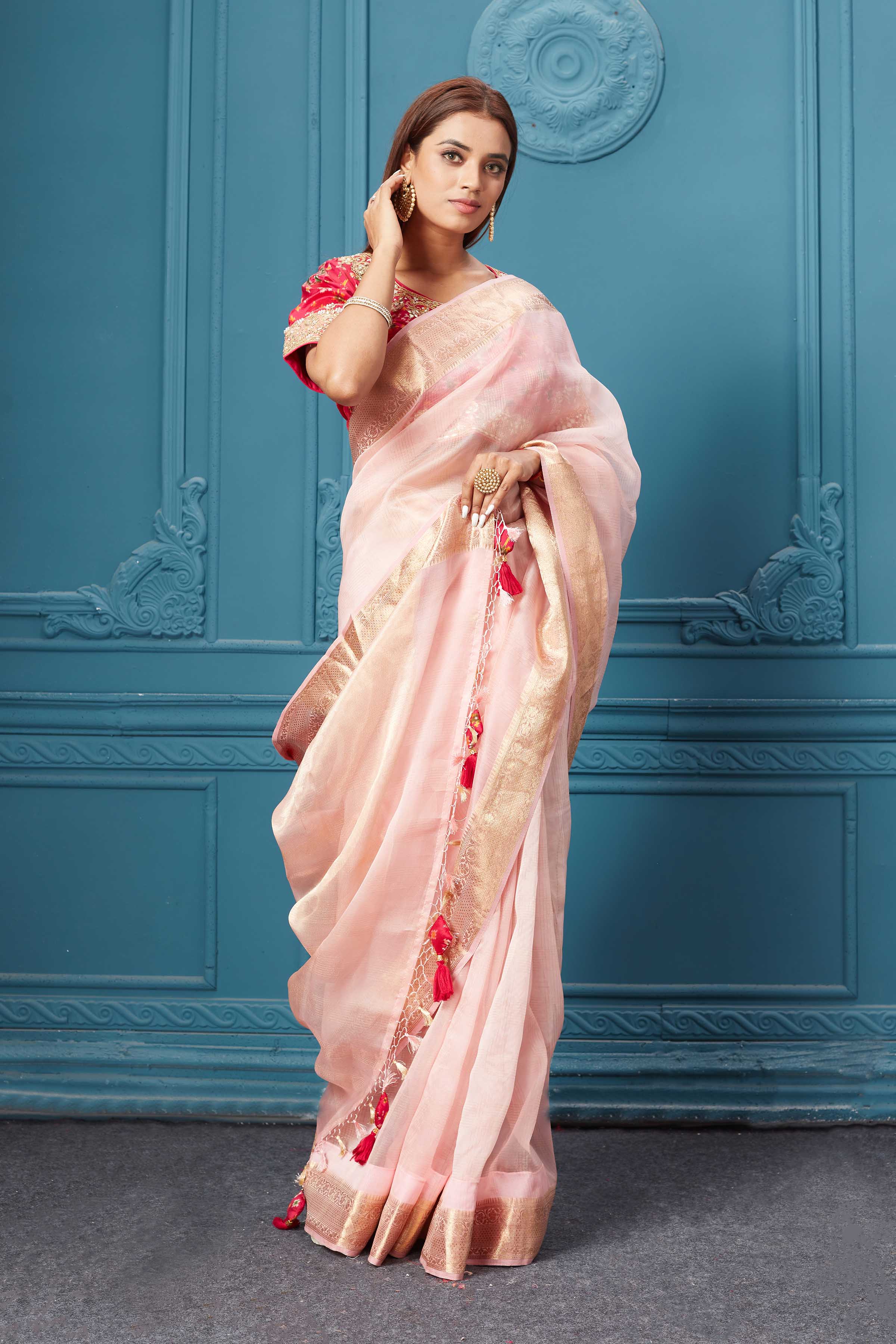 Buy light pink organza silk saree online in USA with pink Patola embroidered blouse. Look royal at weddings and festive occasions in exquisite designer sarees, handwoven sarees, pure silk saris, Banarasi sarees, Kanchipuram silk sarees from Pure Elegance Indian saree store in USA. -saree