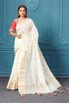 Buy off-white linen Banarasi sari online in USA with red embroidered saree blouse. Look royal at weddings and festive occasions in exquisite designer sarees, handwoven sarees, pure silk saris, Banarasi sarees, Kanchipuram silk sarees from Pure Elegance Indian saree store in USA. -full view