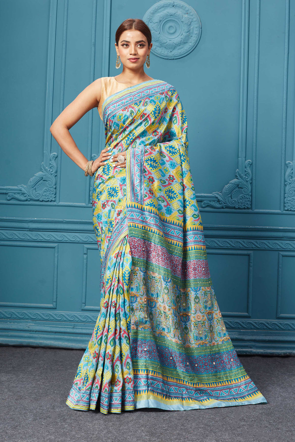 Shop this look for festive occasions from pure elegance. Yellow multi-printed and embroidered mulberry silk saree. It comes with a matching sleeveless blouse. Buy Indian dresses, Indian Suits, and Indian Anarkalis & gowns from pure elegance in the USA.