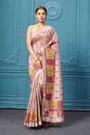 Buy pastel peach chevron Mulberry silk embroidered saree online in USA. Look royal at weddings and festive occasions in exquisite designer sarees, handwoven sarees, pure silk saris, Banarasi sarees, Kanchipuram silk sarees from Pure Elegance Indian saree store in USA. 