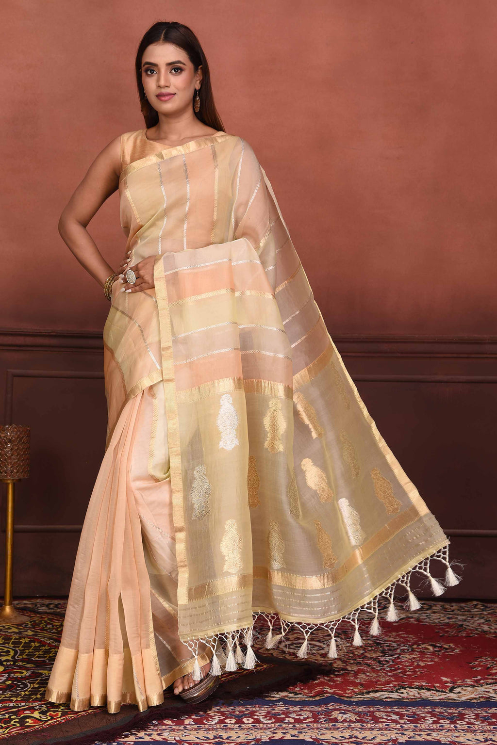 Buy stunning peach striped zari organza Banarasi saree online in USA. Look your best on festive occasions in latest designer sarees, pure silk sarees, Kanchipuram silk sarees, handwoven sarees, tussar silk sarees, embroidered sarees from Pure Elegance Indian clothing store in USA.-full view