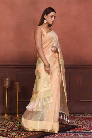 Buy stunning peach striped zari organza Banarasi saree online in USA. Look your best on festive occasions in latest designer sarees, pure silk sarees, Kanchipuram silk sarees, handwoven sarees, tussar silk sarees, embroidered sarees from Pure Elegance Indian clothing store in USA.-side