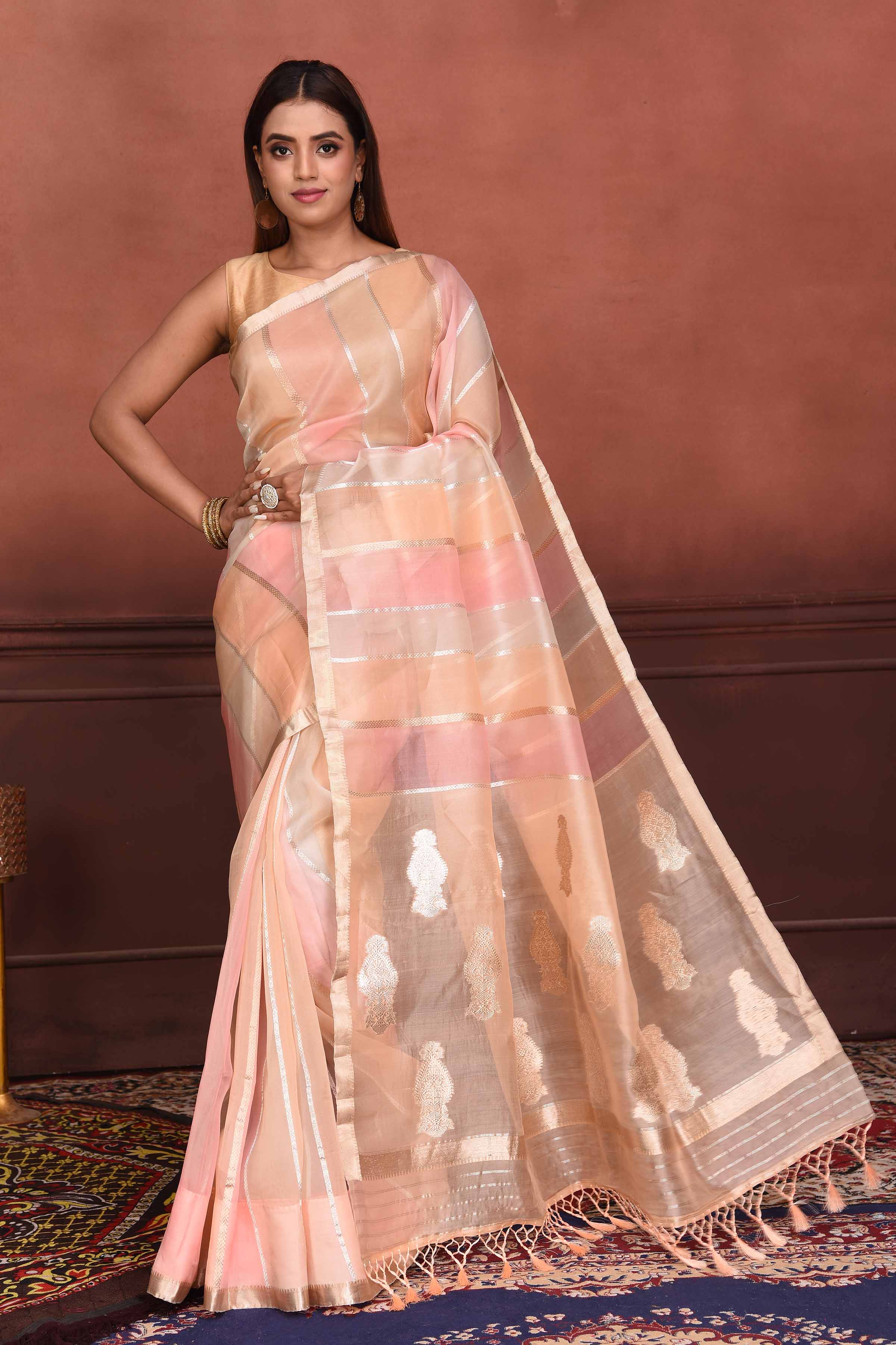 Shop beautiful peach and pink striped zari organza Banarasi saree online in USA. Look your best on festive occasions in latest designer sarees, pure silk sarees, Kanchipuram silk sarees, handwoven sarees, tussar silk sarees, embroidered sarees from Pure Elegance Indian clothing store in USA.-full view