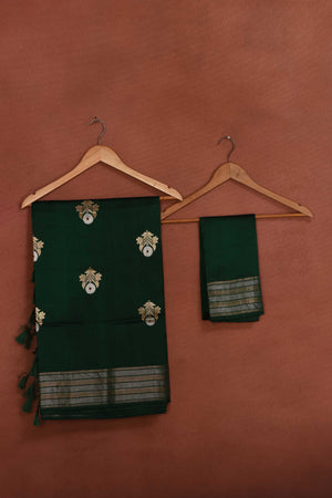 Buy bottle green Katan silk Banarasi saree online in USA with floral buta. Look your best on festive occasions in latest designer sarees, pure silk sarees, Kanchipuram silk sarees, handwoven sarees, tussar silk sarees, embroidered sarees from Pure Elegance Indian clothing store in USA.-blouse