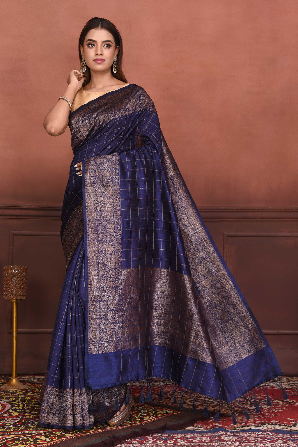 Shop beautiful navy blue tussar Banarasi saree online in USA with antique zari border. Look your best on festive occasions in latest designer sarees, pure silk sarees, Kanchipuram silk sarees, handwoven sarees, tussar silk sarees, embroidered sarees from Pure Elegance Indian clothing store in USA.-full view