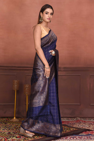 Shop beautiful navy blue tussar Banarasi saree online in USA with antique zari border. Look your best on festive occasions in latest designer sarees, pure silk sarees, Kanchipuram silk sarees, handwoven sarees, tussar silk sarees, embroidered sarees from Pure Elegance Indian clothing store in USA.-side