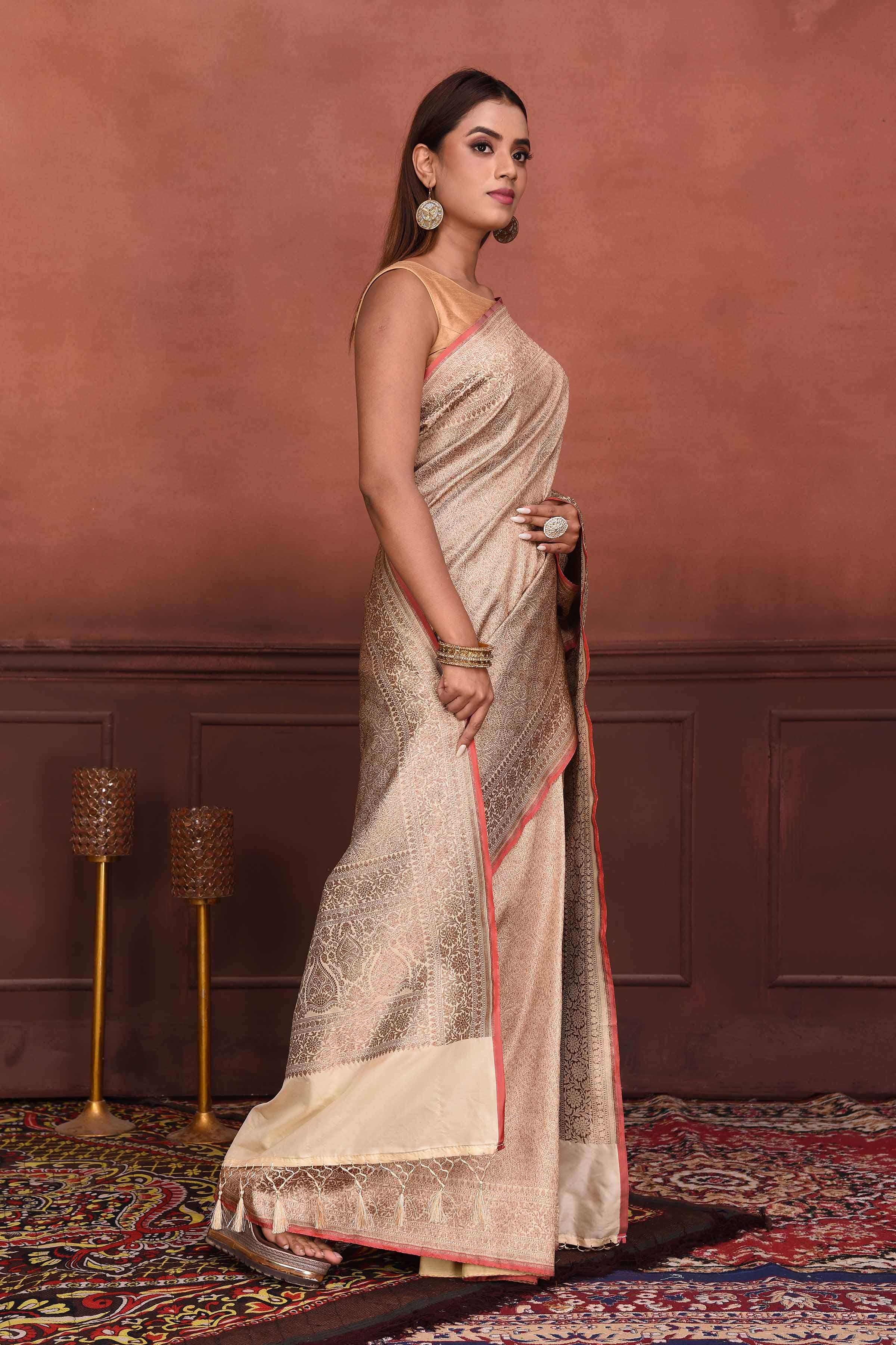 Shop beautiful cream golden Katan silk Banarasi saree online in USA. Look your best on festive occasions in latest designer sarees, pure silk sarees, Kanchipuram silk sarees, handwoven sarees, tussar silk sarees, embroidered sarees from Pure Elegance Indian clothing store in USA.-side