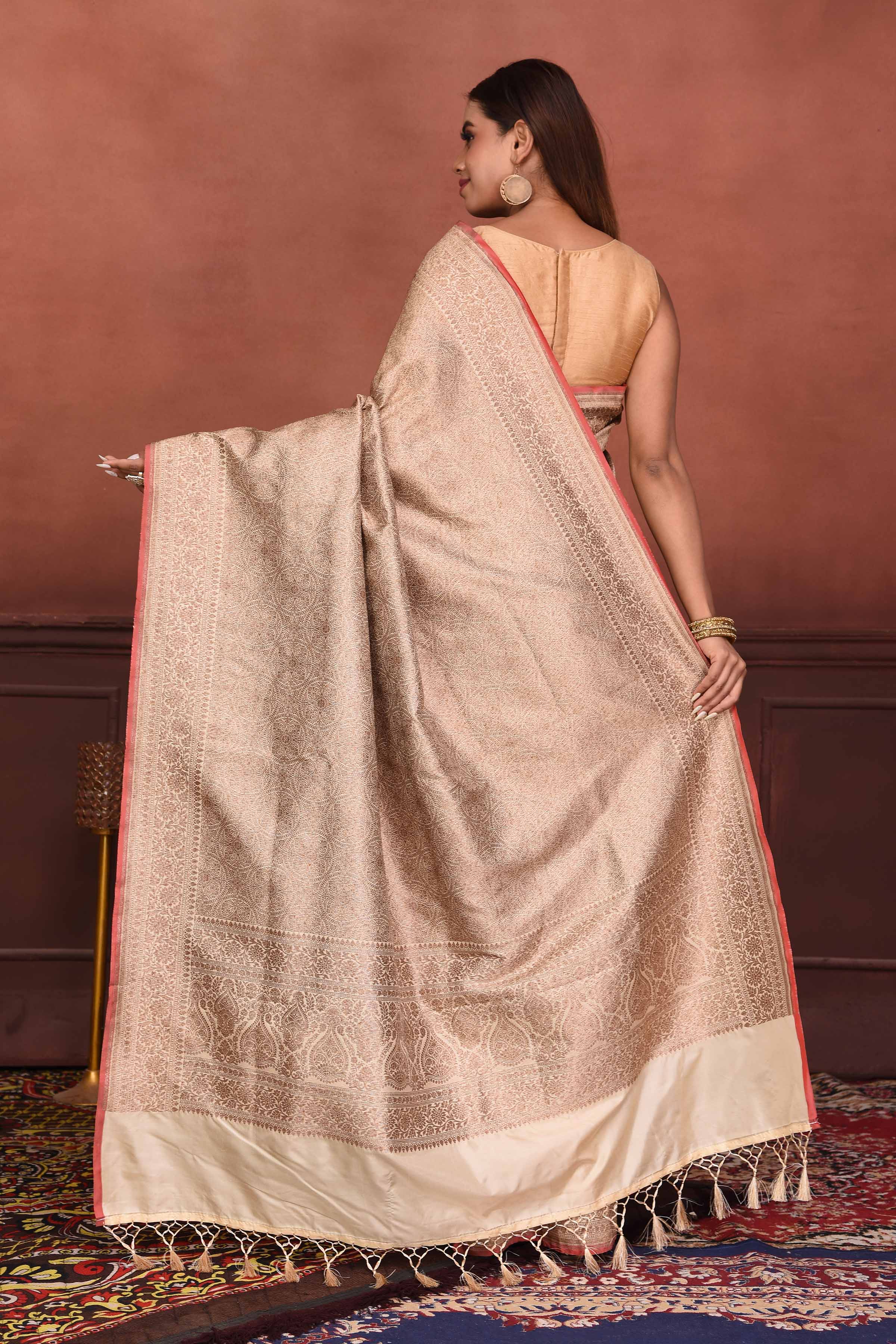 Shop beautiful cream golden Katan silk Banarasi saree online in USA. Look your best on festive occasions in latest designer sarees, pure silk sarees, Kanchipuram silk sarees, handwoven sarees, tussar silk sarees, embroidered sarees from Pure Elegance Indian clothing store in USA.-back