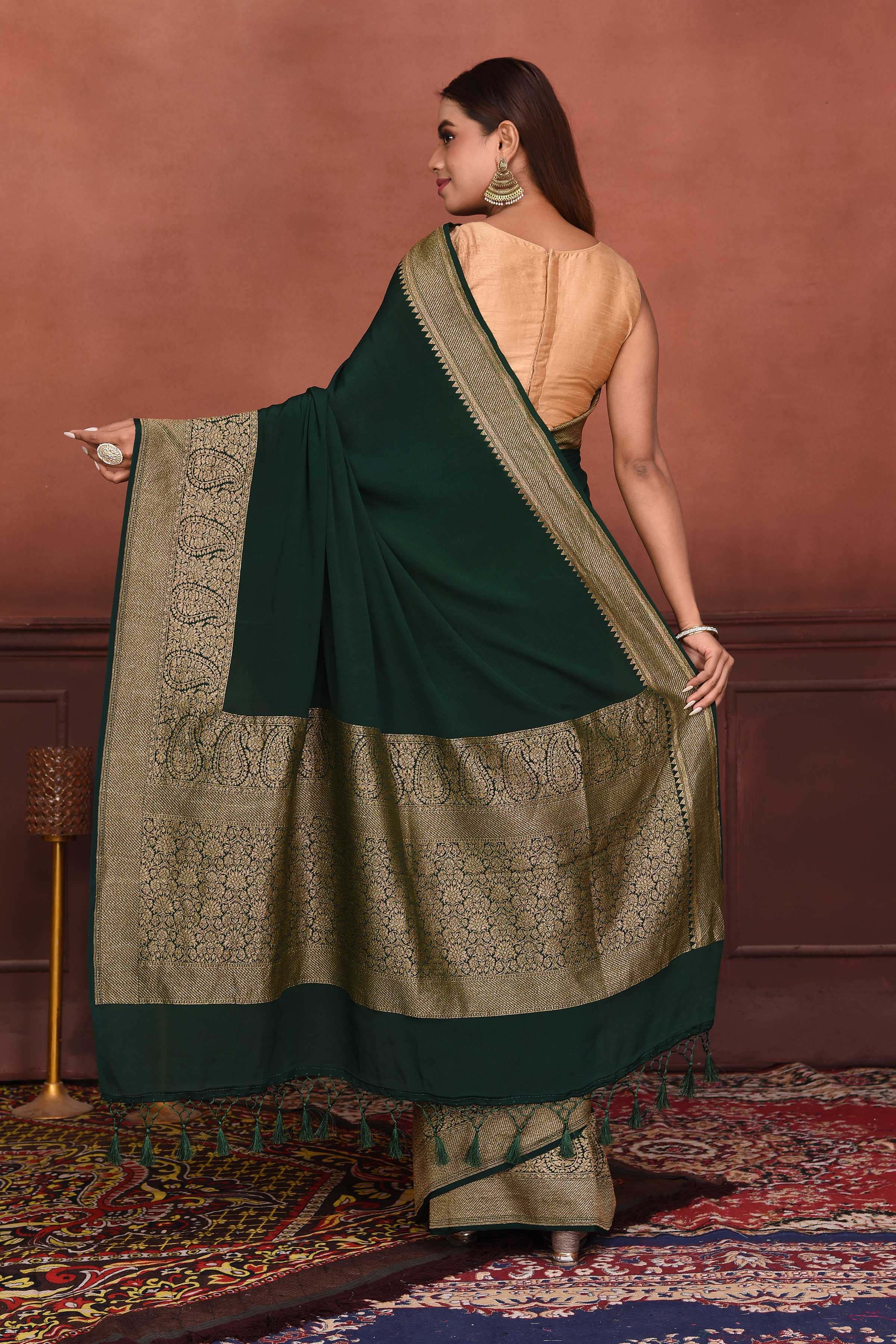 Shop bottle green crepe Banarasi saree online in USA with zari border. Look your best on festive occasions in latest designer sarees, pure silk sarees, Kanchipuram silk sarees, handwoven sarees, tussar silk sarees, embroidered sarees from Pure Elegance Indian clothing store in USA.-back