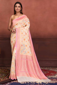 Buy cream georgette Banarasi saree online in USA with pink zari border. Look your best on festive occasions in latest designer sarees, pure silk sarees, Kanchipuram silk sarees, handwoven sarees, tussar silk sarees, embroidered sarees from Pure Elegance Indian clothing store in USA.-full view