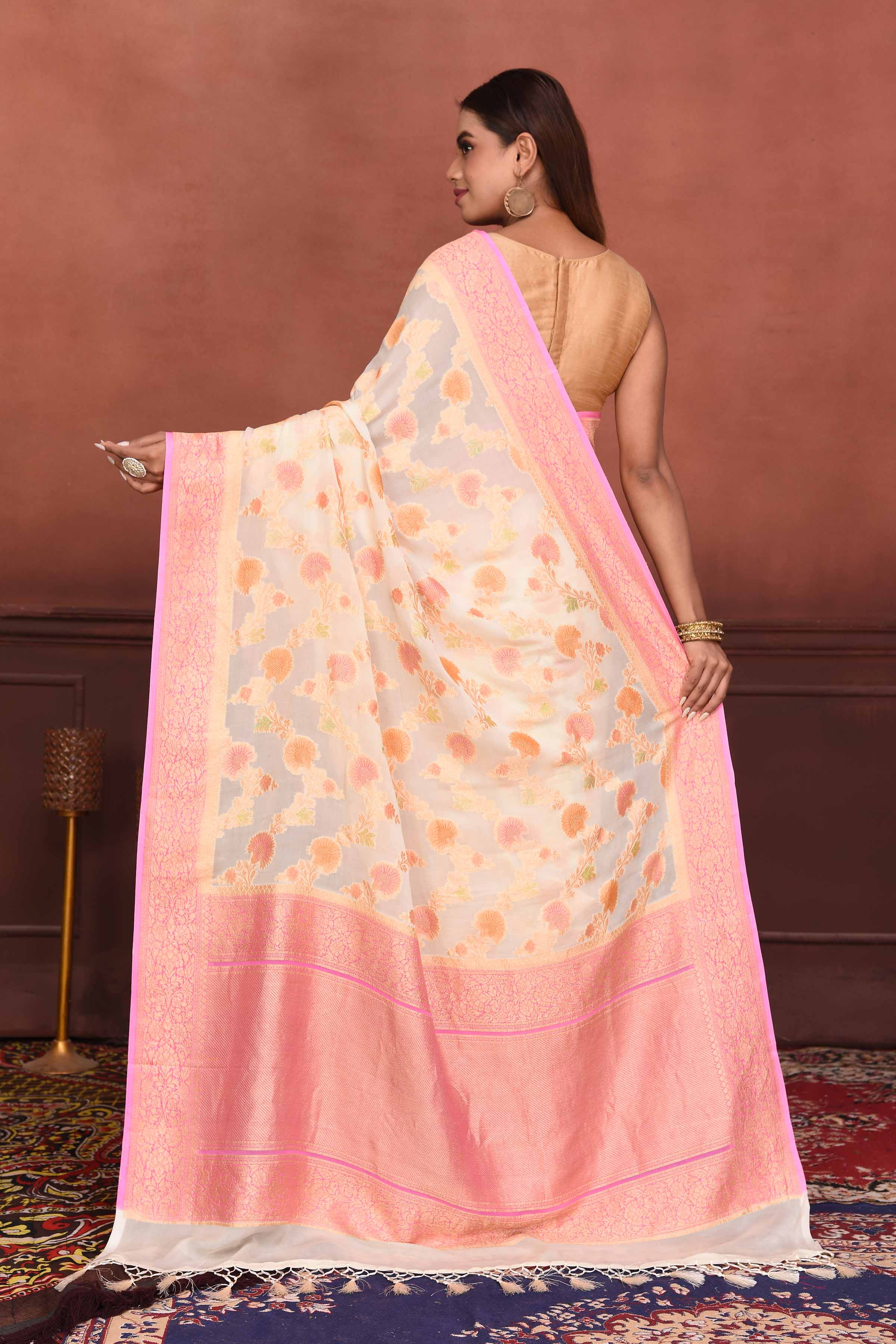 Buy cream georgette Banarasi saree online in USA with pink zari border. Look your best on festive occasions in latest designer sarees, pure silk sarees, Kanchipuram silk sarees, handwoven sarees, tussar silk sarees, embroidered sarees from Pure Elegance Indian clothing store in USA.-back