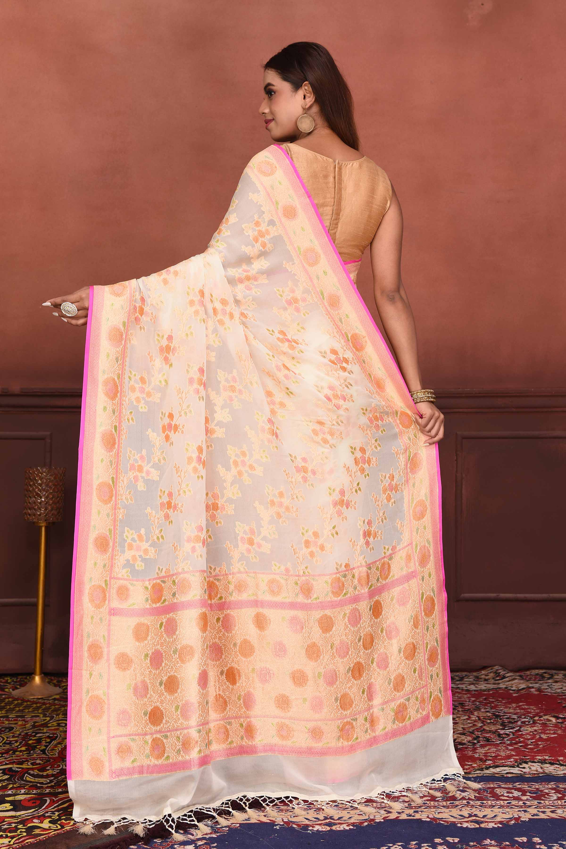 Shop cream georgette Banarasi saree online in USA with floral zari work. Look your best on festive occasions in latest designer sarees, pure silk sarees, Kanchipuram silk sarees, handwoven sarees, tussar silk sarees, embroidered sarees from Pure Elegance Indian clothing store in USA.-back