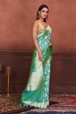 Shop beautiful sea green Katan silk Banarasi sari online in USA with zari minakari work. Look your best on festive occasions in latest designer sarees, pure silk sarees, Kanchipuram silk sarees, handwoven sarees, tussar silk sarees, embroidered sarees from Pure Elegance Indian clothing store in USA.-side